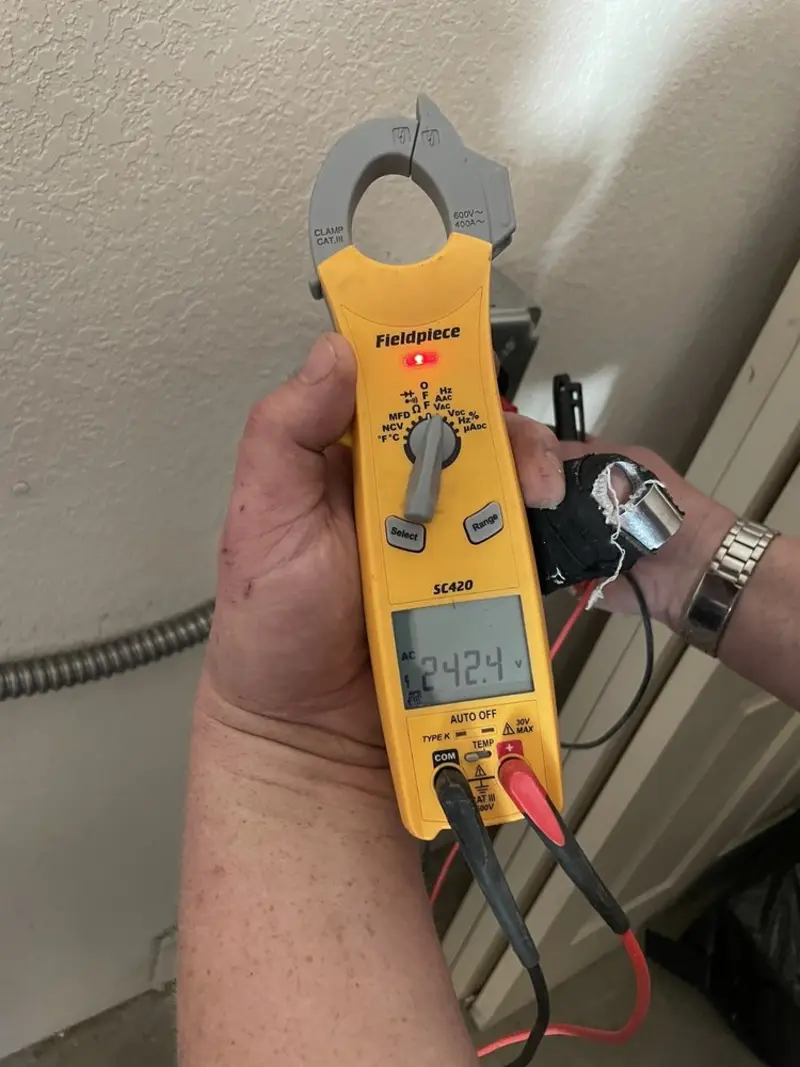 Voltage testing with clamp meter during Electrical Installation Services in Forest Park